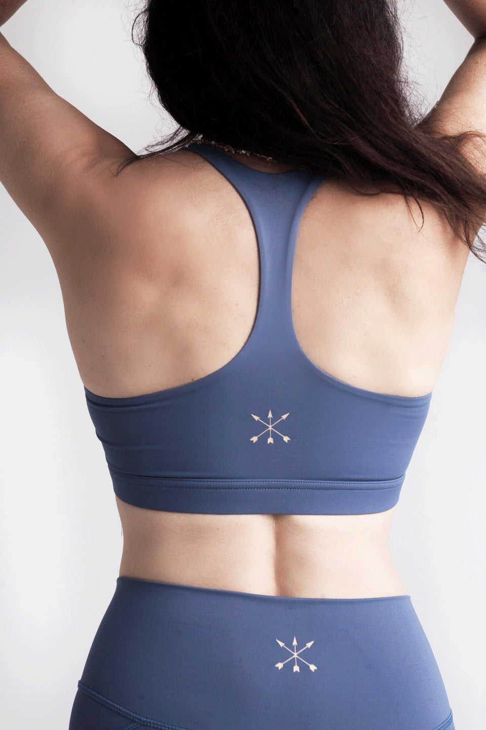 Soft Recycled Sports Bra - Blue on model from behind