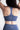 Soft Recycled Sports Bra - Blue on model from behind
