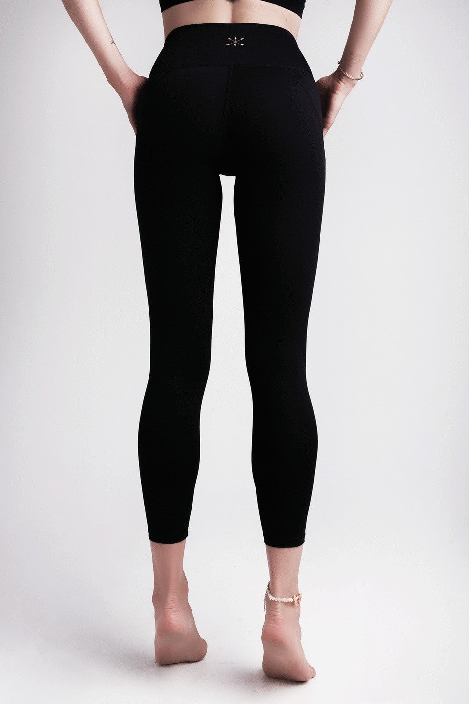 Soft Recycled Leggings With Pockets - Black on model from behind